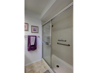 This end unit villa is right next to the covered carport and on Highland Lakes Executive Golf Course in Florida - for sale on GolfHomes.com, golf home, golf lot