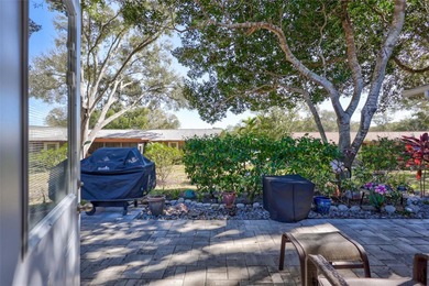 This end unit villa is right next to the covered carport and on Highland Lakes Executive Golf Course in Florida - for sale on GolfHomes.com, golf home, golf lot