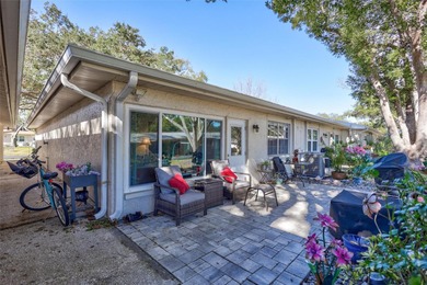 This end unit villa is right next to the covered carport and on Highland Lakes Executive Golf Course in Florida - for sale on GolfHomes.com, golf home, golf lot