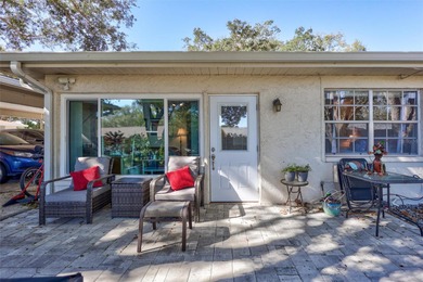 This end unit villa is right next to the covered carport and on Highland Lakes Executive Golf Course in Florida - for sale on GolfHomes.com, golf home, golf lot