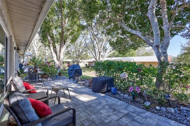 This end unit villa is right next to the covered carport and on Highland Lakes Executive Golf Course in Florida - for sale on GolfHomes.com, golf home, golf lot