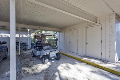 This end unit villa is right next to the covered carport and on Highland Lakes Executive Golf Course in Florida - for sale on GolfHomes.com, golf home, golf lot