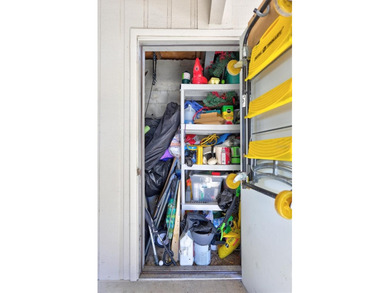 This end unit villa is right next to the covered carport and on Highland Lakes Executive Golf Course in Florida - for sale on GolfHomes.com, golf home, golf lot