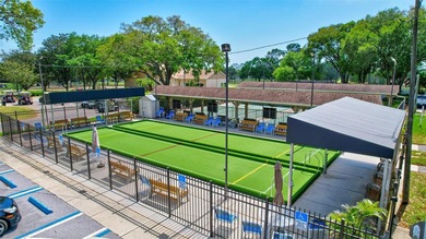 This end unit villa is right next to the covered carport and on Highland Lakes Executive Golf Course in Florida - for sale on GolfHomes.com, golf home, golf lot