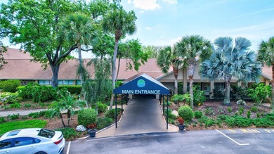 This end unit villa is right next to the covered carport and on Highland Lakes Executive Golf Course in Florida - for sale on GolfHomes.com, golf home, golf lot