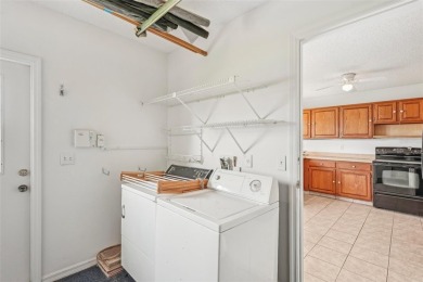 Welcome to this stunning 2-bedroom, 2-bath waterfront home on Caloosa Greens Executive Golf Course in Florida - for sale on GolfHomes.com, golf home, golf lot