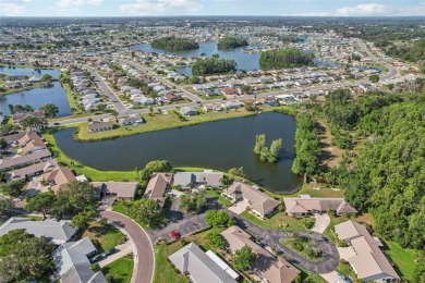 Welcome to this stunning 2-bedroom, 2-bath waterfront home on Caloosa Greens Executive Golf Course in Florida - for sale on GolfHomes.com, golf home, golf lot