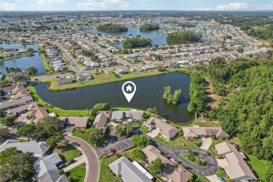 Welcome to this stunning 2-bedroom, 2-bath waterfront home on Caloosa Greens Executive Golf Course in Florida - for sale on GolfHomes.com, golf home, golf lot