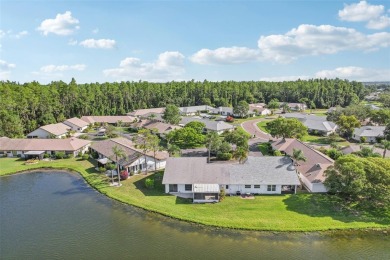 Welcome to this stunning 2-bedroom, 2-bath waterfront home on Caloosa Greens Executive Golf Course in Florida - for sale on GolfHomes.com, golf home, golf lot