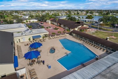 Welcome to this stunning 2-bedroom, 2-bath waterfront home on Caloosa Greens Executive Golf Course in Florida - for sale on GolfHomes.com, golf home, golf lot