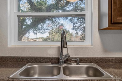 Refreshed and move-in ready, this three-bedroom, cottage-style on Osceola Municipal Golf Course in Florida - for sale on GolfHomes.com, golf home, golf lot