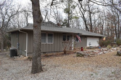 This property is within walking distance to golf course, close on Cherokee Village North Course in Arkansas - for sale on GolfHomes.com, golf home, golf lot