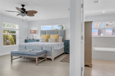 This Key Colony Beach coastal retreat blends modern elegance on Key Colony Beach Golf Course in Florida - for sale on GolfHomes.com, golf home, golf lot