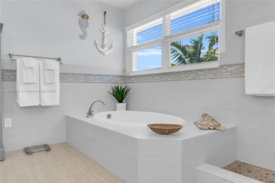 This Key Colony Beach coastal retreat blends modern elegance on Key Colony Beach Golf Course in Florida - for sale on GolfHomes.com, golf home, golf lot