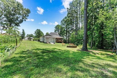 Custom-crafted by Bellamy Homes, this sprawling RANCH is a true on Cowans Ford Country Club in North Carolina - for sale on GolfHomes.com, golf home, golf lot