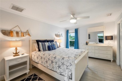 This Key Colony Beach coastal retreat blends modern elegance on Key Colony Beach Golf Course in Florida - for sale on GolfHomes.com, golf home, golf lot