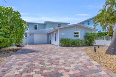 This Key Colony Beach coastal retreat blends modern elegance on Key Colony Beach Golf Course in Florida - for sale on GolfHomes.com, golf home, golf lot