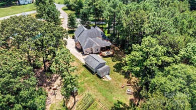 Custom-crafted by Bellamy Homes, this sprawling RANCH is a true on Cowans Ford Country Club in North Carolina - for sale on GolfHomes.com, golf home, golf lot