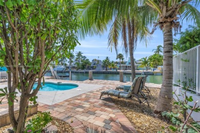 This Key Colony Beach coastal retreat blends modern elegance on Key Colony Beach Golf Course in Florida - for sale on GolfHomes.com, golf home, golf lot