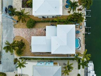 This Key Colony Beach coastal retreat blends modern elegance on Key Colony Beach Golf Course in Florida - for sale on GolfHomes.com, golf home, golf lot