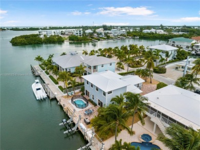 This Key Colony Beach coastal retreat blends modern elegance on Key Colony Beach Golf Course in Florida - for sale on GolfHomes.com, golf home, golf lot