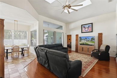 Beautifully updated 4BR/3BA custom home with a 3-car garage on The Grand Club - Pine Lakes Course in Florida - for sale on GolfHomes.com, golf home, golf lot