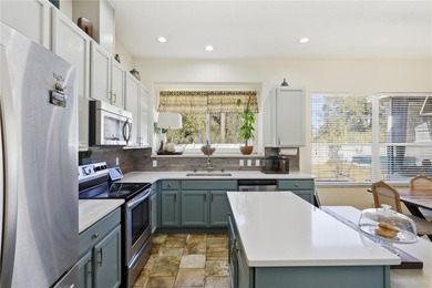 Beautifully updated 4BR/3BA custom home with a 3-car garage on The Grand Club - Pine Lakes Course in Florida - for sale on GolfHomes.com, golf home, golf lot