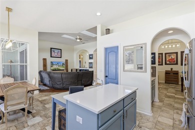 Beautifully updated 4BR/3BA custom home with a 3-car garage on The Grand Club - Pine Lakes Course in Florida - for sale on GolfHomes.com, golf home, golf lot