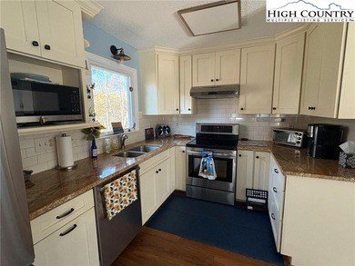 Walk to Golf and The Patio Grill from this nicely updated on Land Harbor Golf Course in North Carolina - for sale on GolfHomes.com, golf home, golf lot