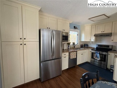 Walk to Golf and The Patio Grill from this nicely updated on Land Harbor Golf Course in North Carolina - for sale on GolfHomes.com, golf home, golf lot