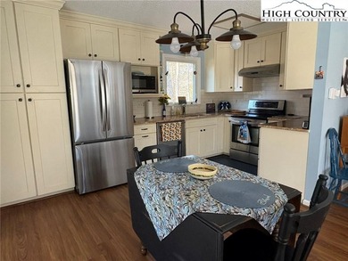 Walk to Golf and The Patio Grill from this nicely updated on Land Harbor Golf Course in North Carolina - for sale on GolfHomes.com, golf home, golf lot