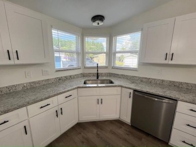 This beautifully renovated 3BED/2BATH open-concept home blends on Del Tura Golf and Country Club in Florida - for sale on GolfHomes.com, golf home, golf lot