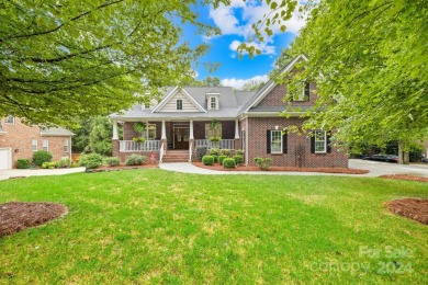 Nestled in the prestigious Shannamara community, this brick on The Divide Golf Club in North Carolina - for sale on GolfHomes.com, golf home, golf lot