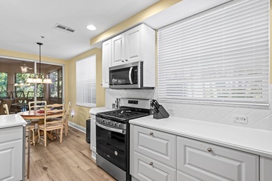 Delightful Deer Crossing 3 bedroom, 2 bath 1st floor end unit on The Rookery At Marco in Florida - for sale on GolfHomes.com, golf home, golf lot