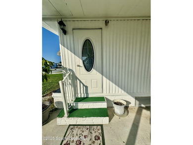 Welcome to the vibrant Barefoot Bay community! This 2-bedroom on Barefoot Bay Golf Course in Florida - for sale on GolfHomes.com, golf home, golf lot