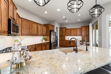 Experience elevated desert living in this HIGHLY UPGRADED on Trilogy Golf Club At Vistancia in Arizona - for sale on GolfHomes.com, golf home, golf lot