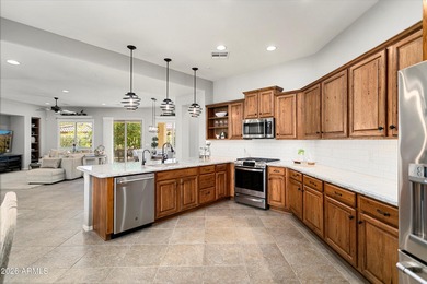 Experience elevated desert living in this HIGHLY UPGRADED on Trilogy Golf Club At Vistancia in Arizona - for sale on GolfHomes.com, golf home, golf lot