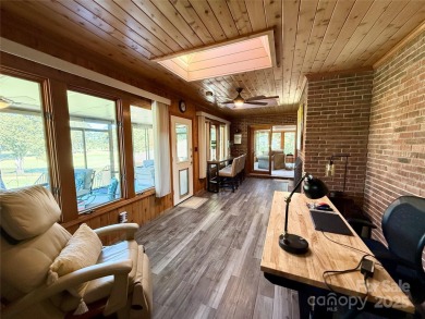 Welcome to this extraordinary all-brick estate, perfectly on Pine Island Country Club in North Carolina - for sale on GolfHomes.com, golf home, golf lot