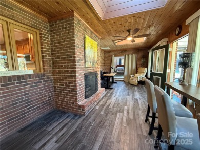 Welcome to this extraordinary all-brick estate, perfectly on Pine Island Country Club in North Carolina - for sale on GolfHomes.com, golf home, golf lot