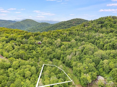 Experience authentic high-elevation mountain living on this on Wolf Laurel Country Club in North Carolina - for sale on GolfHomes.com, golf home, golf lot