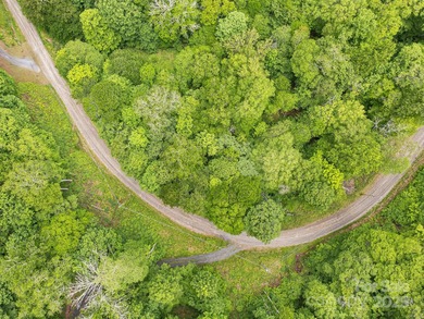 Experience authentic high-elevation mountain living on this on Wolf Laurel Country Club in North Carolina - for sale on GolfHomes.com, golf home, golf lot