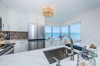 Enjoy spectacular views of Boca Ciega Bay from the moment you on Isla Del Sol Yacht and Country Club in Florida - for sale on GolfHomes.com, golf home, golf lot