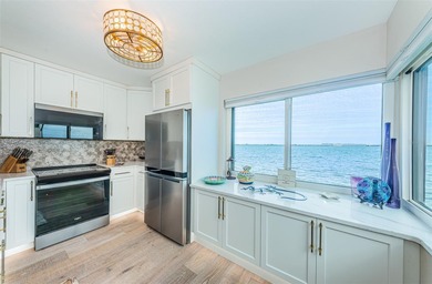 Enjoy spectacular views of Boca Ciega Bay from the moment you on Isla Del Sol Yacht and Country Club in Florida - for sale on GolfHomes.com, golf home, golf lot