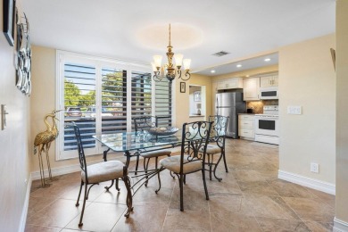 Enjoy picturesque views of the lush golf course and serene on Quail Ridge Golf Course and Country Club in Florida - for sale on GolfHomes.com, golf home, golf lot