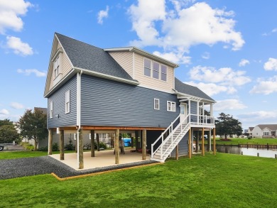 Have you been searching the coast for your dream waterfront home on Captains Cove Golf and Yacht Club in Virginia - for sale on GolfHomes.com, golf home, golf lot