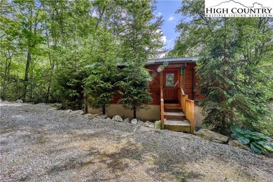 One bedroom, one bath Green River Log Cabin located in the on Land Harbor Golf Course in North Carolina - for sale on GolfHomes.com, golf home, golf lot