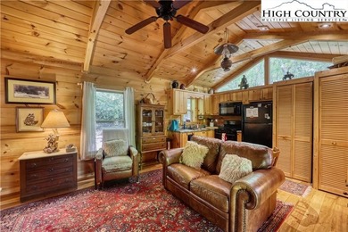 One bedroom, one bath Green River Log Cabin located in the on Land Harbor Golf Course in North Carolina - for sale on GolfHomes.com, golf home, golf lot