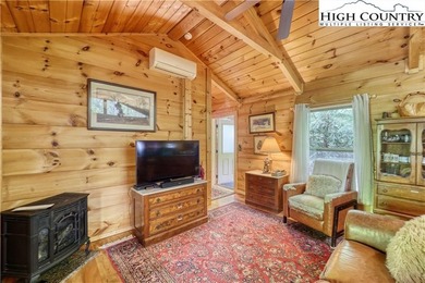 One bedroom, one bath Green River Log Cabin located in the on Land Harbor Golf Course in North Carolina - for sale on GolfHomes.com, golf home, golf lot