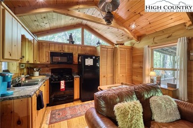 One bedroom, one bath Green River Log Cabin located in the on Land Harbor Golf Course in North Carolina - for sale on GolfHomes.com, golf home, golf lot