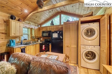 One bedroom, one bath Green River Log Cabin located in the on Land Harbor Golf Course in North Carolina - for sale on GolfHomes.com, golf home, golf lot